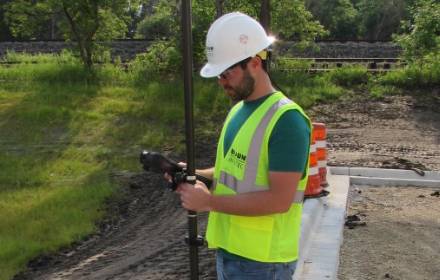 Braun employee outside working on geospatial operations